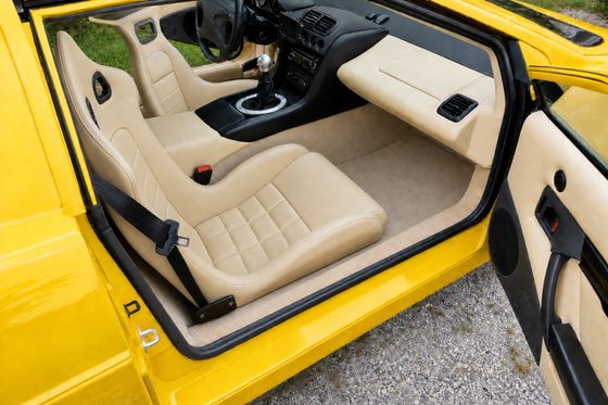 AI-generated preview of a beige 2000 Lotus Esprit V8 interior with Corbeau LE-Pro seats