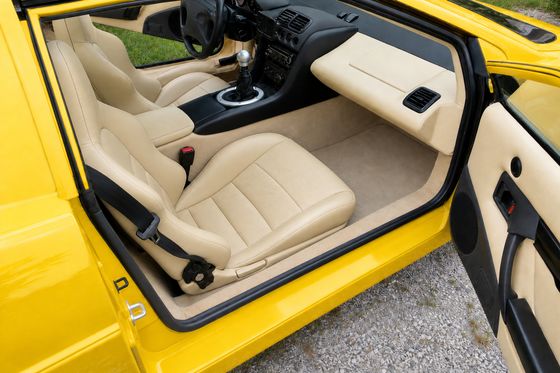 AI-generated preview of a beige 2000 Lotus Esprit V8 interior with Honda S2000 seats
