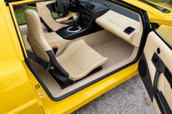 AI-generated preview of a beige 2000 Lotus Esprit V8 interior with Lotus Elise ProBax seats