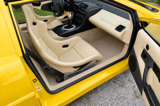 AI-generated preview of a beige 2000 Lotus Esprit V8 interior with Recaro Pole Position seats