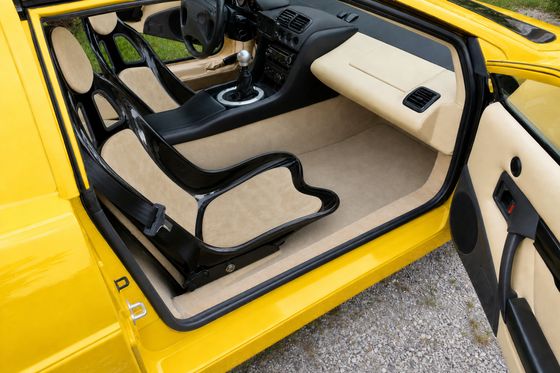 AI-generated preview of a beige 2000 Lotus Esprit V8 interior with Tillett B5 seats