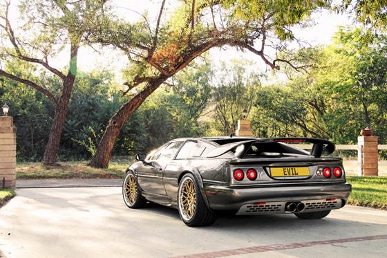 AI-generated preview of a dark grey 2000 Lotus Esprit V8, rear left view, on Splux SD-01S wheels